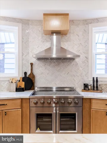 a kitchen with a stove and a sink