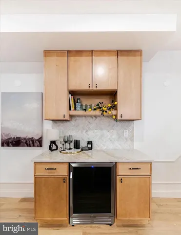 a kitchen with stainless steel appliances a sink stove and cabinets