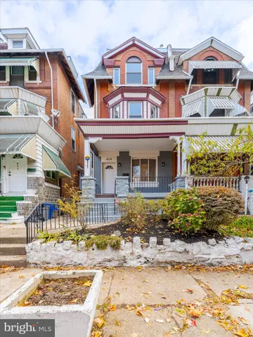 a front view of a building with garden
