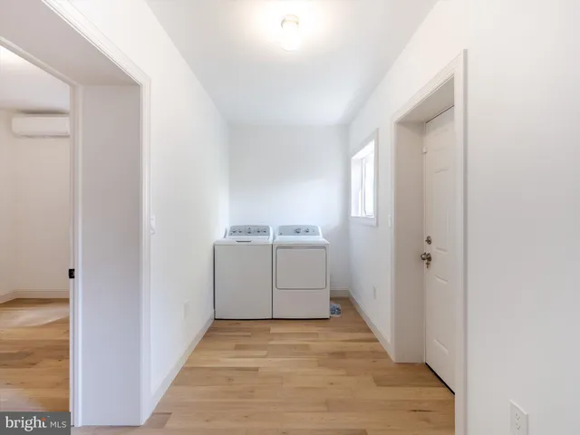 a view of a utility room with washer and dryer