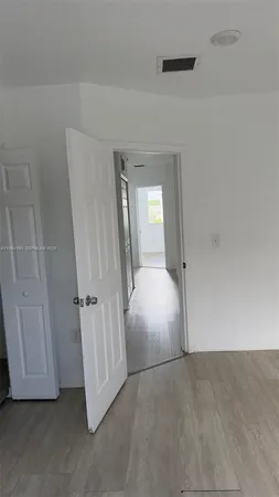 an empty room with a mirror