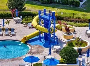 a view of a chairs and table in backyard