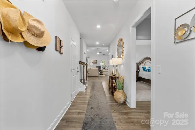 a hallway with a view of living room