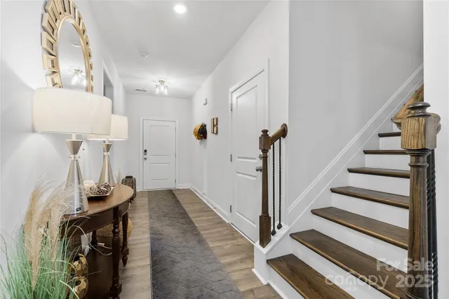 a view of a hallway with paintings on the wall