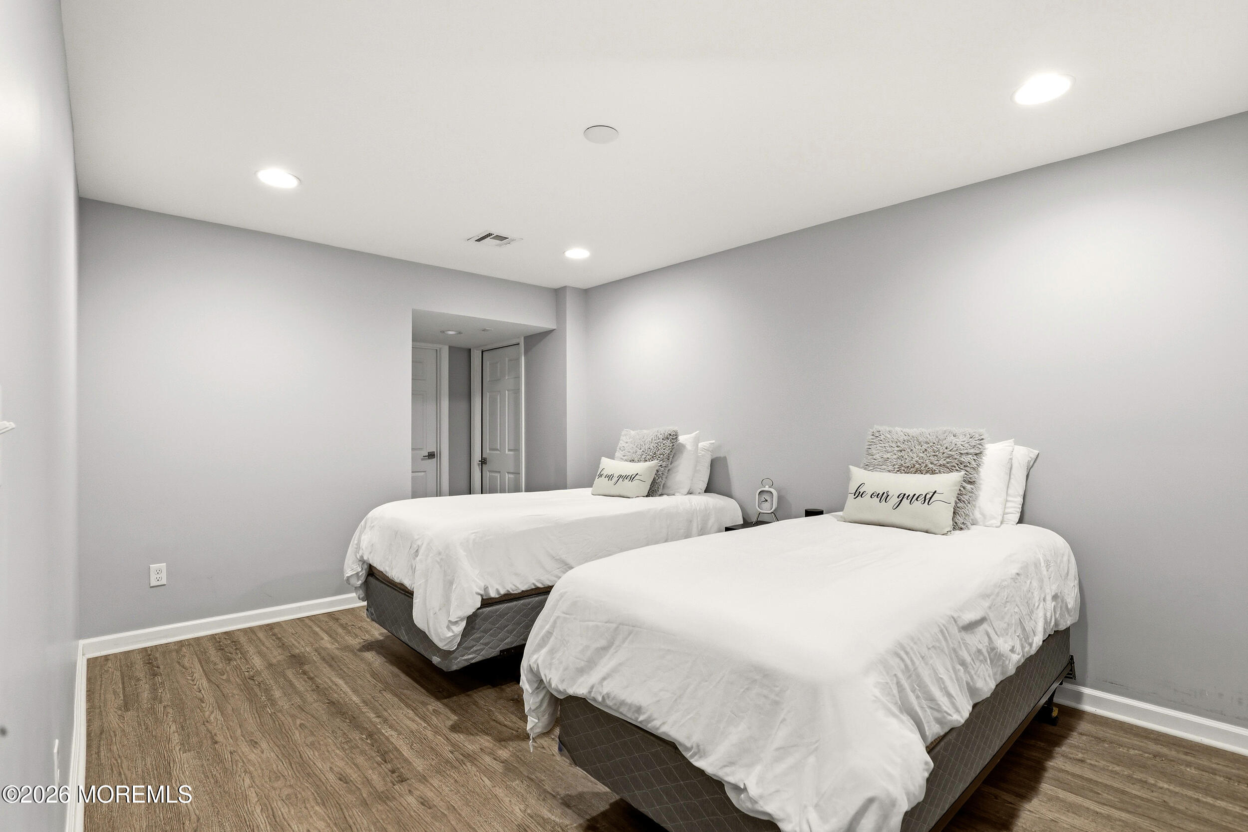 2055 MacKenzie Road Toms River, NJ 08755 - Photo 37 of 56 a spacious bedroom with two beds and wooden floor