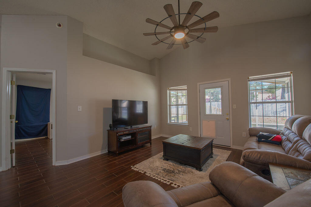 903 Lajolla Lane Mary Esther, FL 32569 - Photo 23 of 47 a living room with furniture a ceiling fan and a window