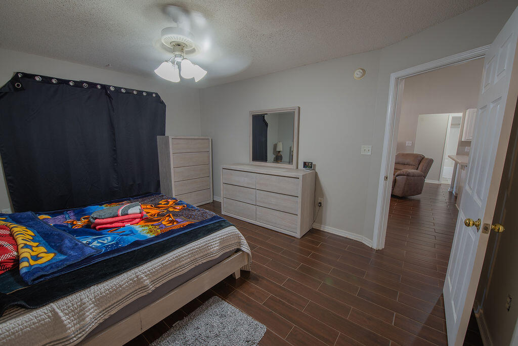 903 Lajolla Lane Mary Esther, FL 32569 - Photo 30 of 47 a bedroom with bed and furniture