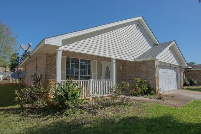 a front view of a house with garden