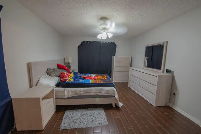 a bedroom with furniture and a chandelier