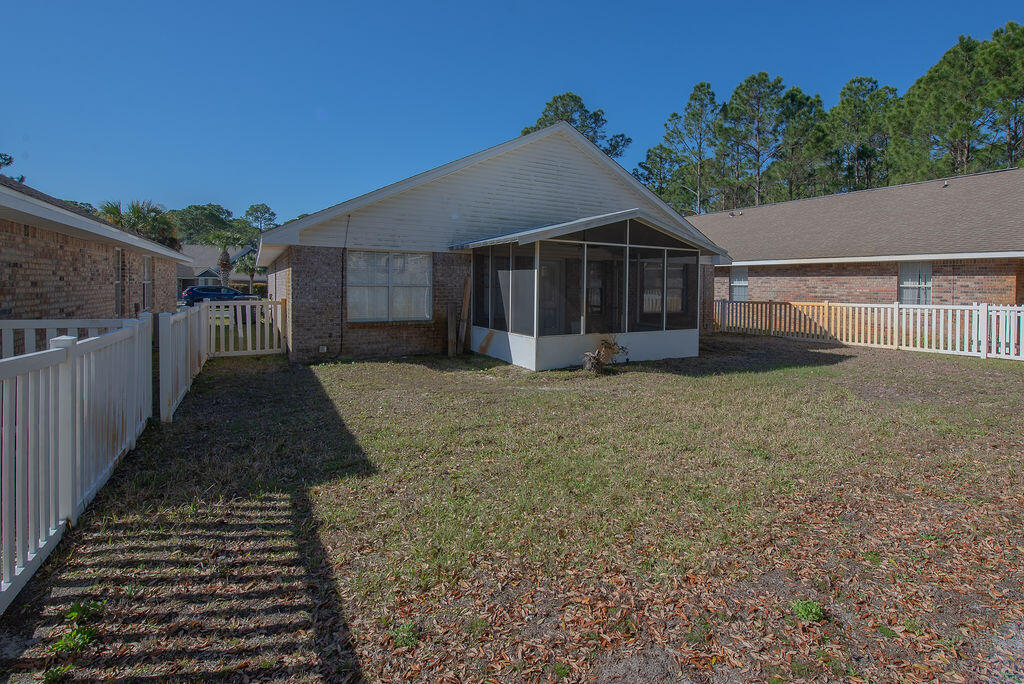 903 Lajolla Lane Mary Esther, FL 32569 - Photo 39 of 47 a front view of a house with a yard