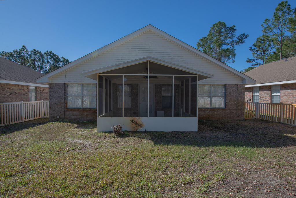 903 Lajolla Lane Mary Esther, FL 32569 - Photo 40 of 47 a view of a house with a yard and large tree