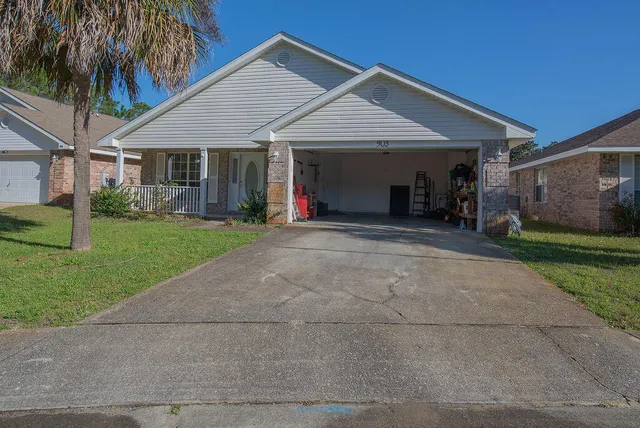 a front view of a house with a yard and porch