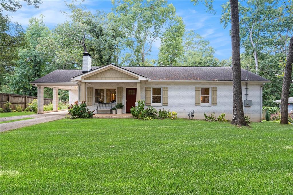 a front view of a house with a garden