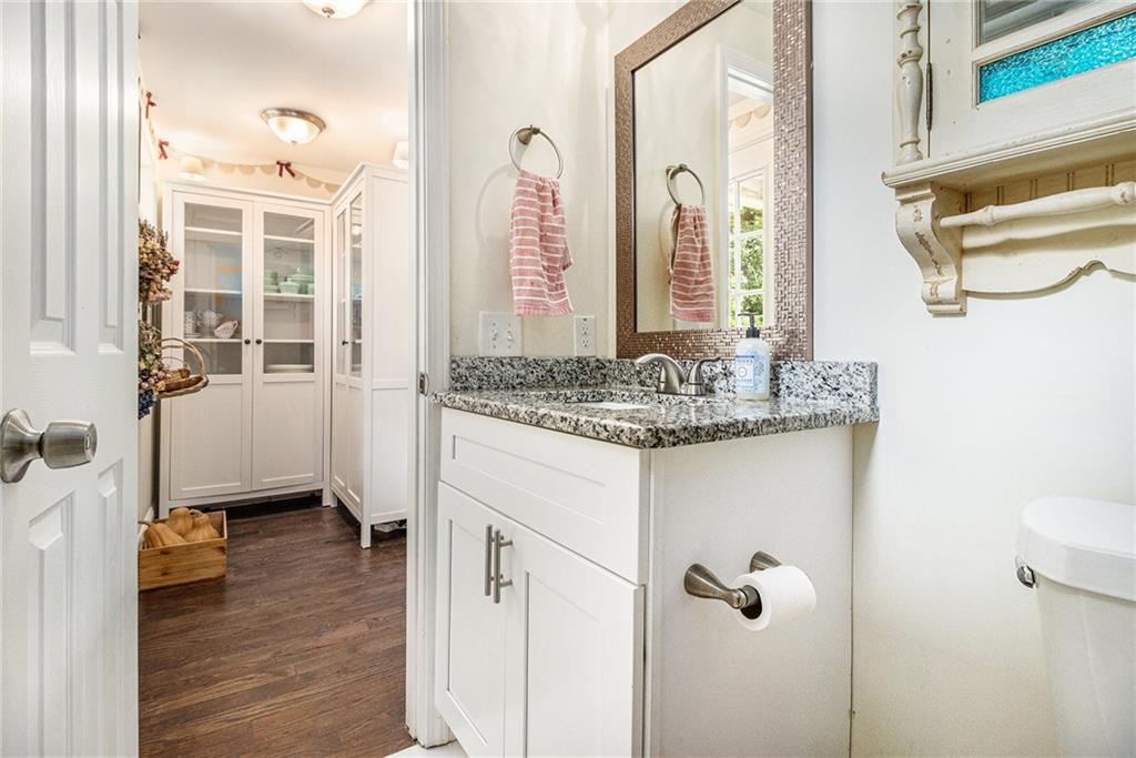 1347 Dorothy Drive Decatur, GA 30030 - Photo 18 of 38 a en suite bathroom with a granite countertop sink and a mirror