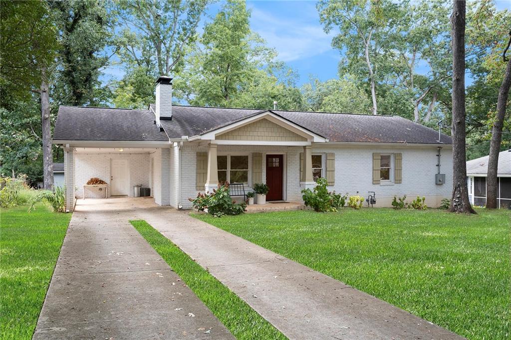 1347 Dorothy Drive Decatur, GA 30030 - Photo 2 of 38 a front view of a house with a yard