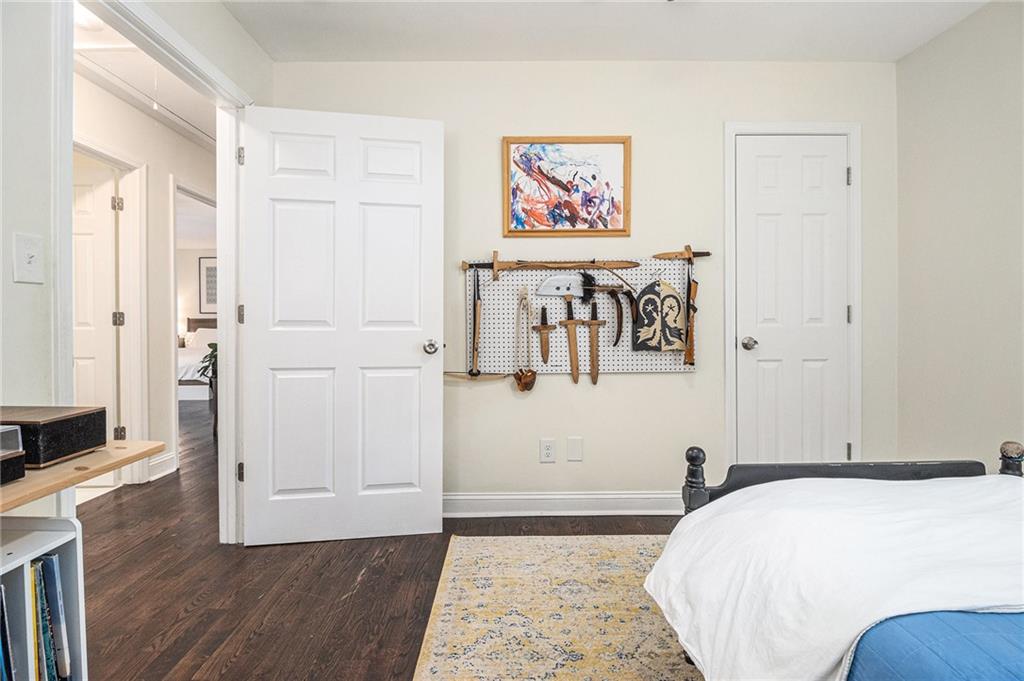 1347 Dorothy Drive Decatur, GA 30030 - Photo 30 of 38 a bedroom with a bed and a painting on the wall