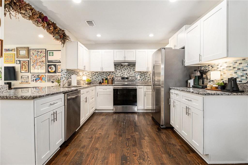 1347 Dorothy Drive Decatur, GA 30030 - Photo 8 of 38 a kitchen with stainless steel appliances a stove sink and refrigerator