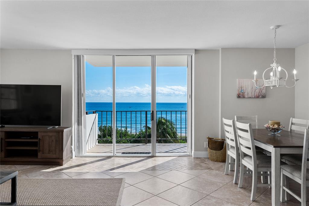 1900 South Ocean Boulevard, Unit 5F Pompano Beach, FL 33062 - Photo 1 of 23 a view of a livingroom with furniture wooden floor and a flat screen tv
