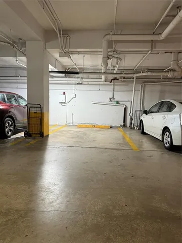 a room with a mirror and a rug