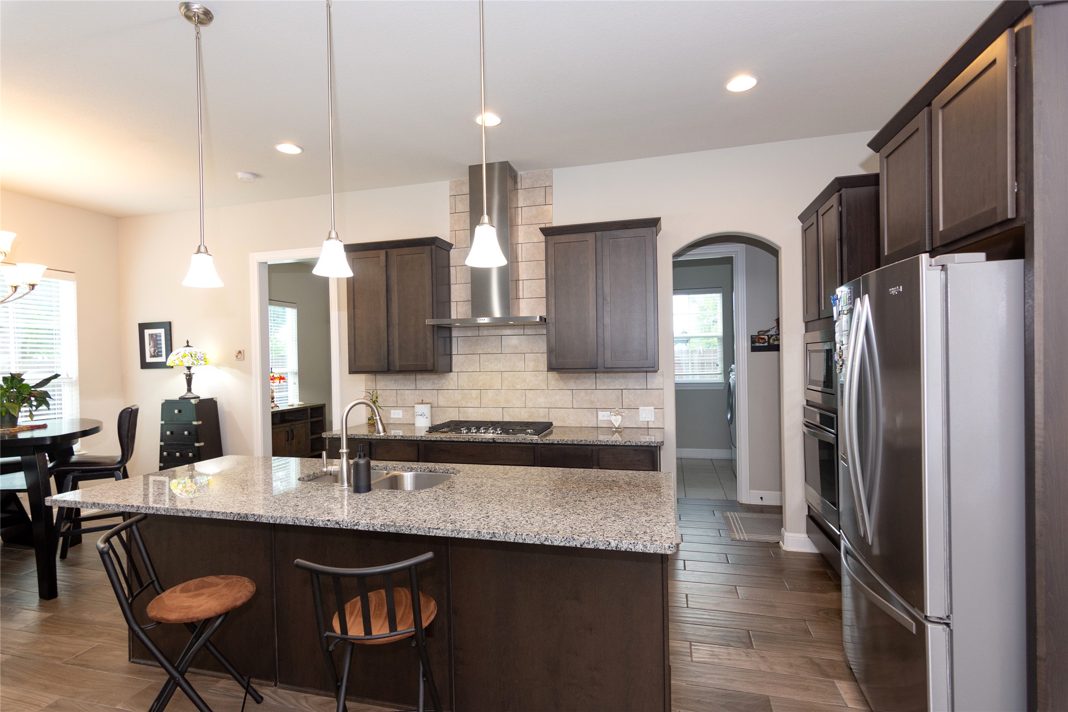 4733 Collins Street, Unit 610 Round Rock, TX 78628 - Photo 11 of 36 a kitchen with stainless steel appliances granite countertop a sink refrigerator and cabinets