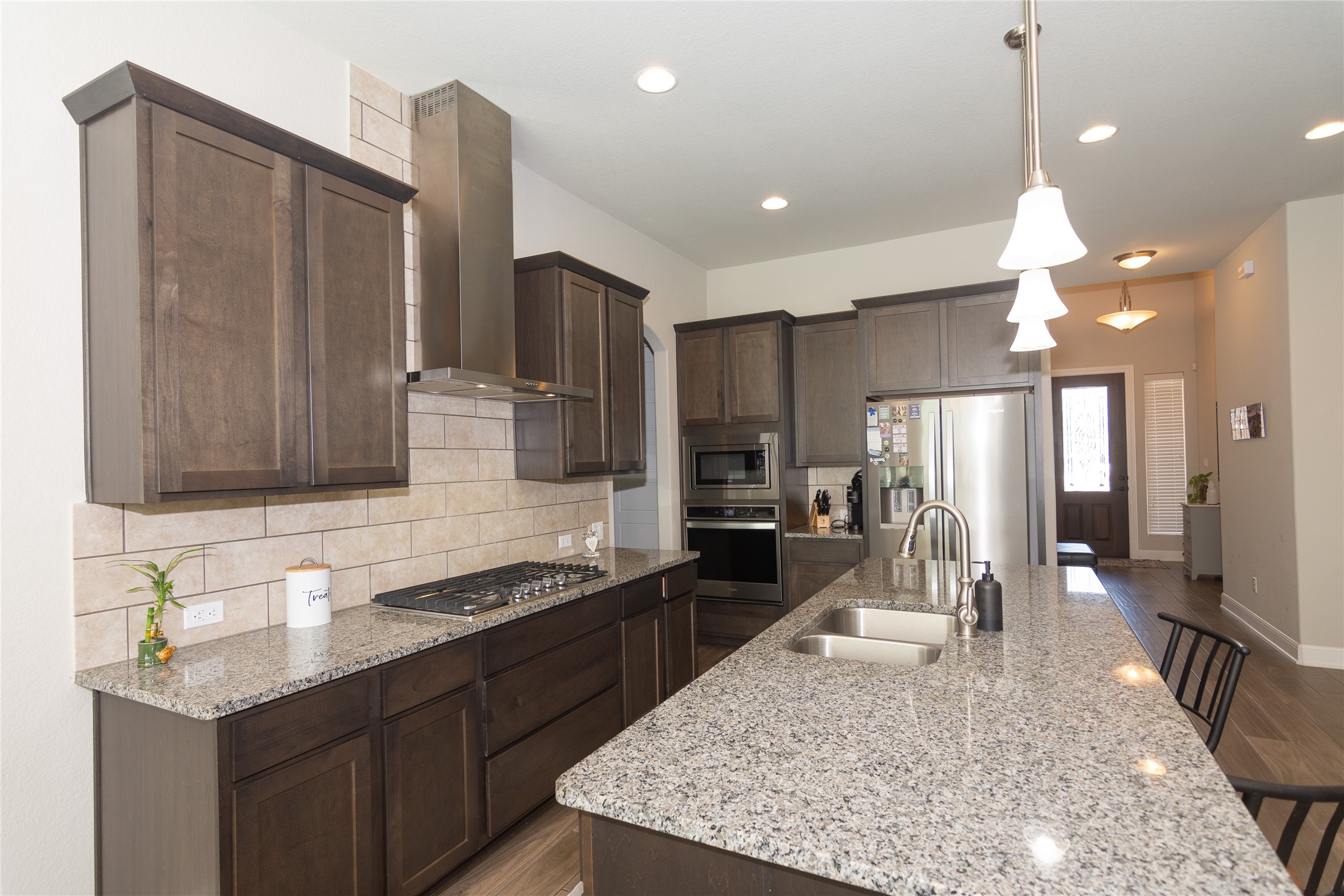 4733 Collins Street, Unit 610 Round Rock, TX 78628 - Photo 12 of 36 a kitchen with a sink stove and refrigerator
