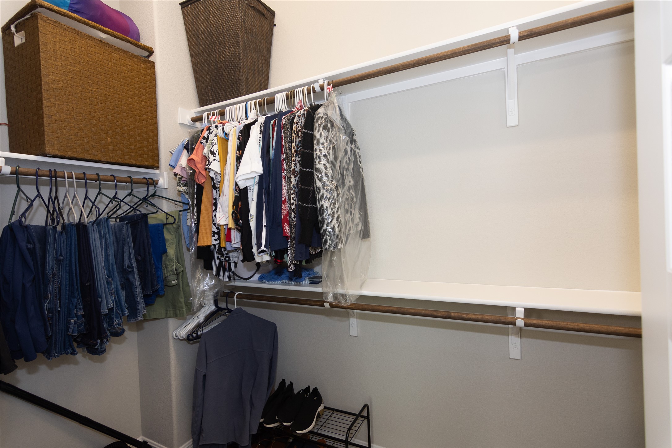 4733 Collins Street, Unit 610 Round Rock, TX 78628 - Photo 22 of 36 a view of walk in closet with clothes and shoes