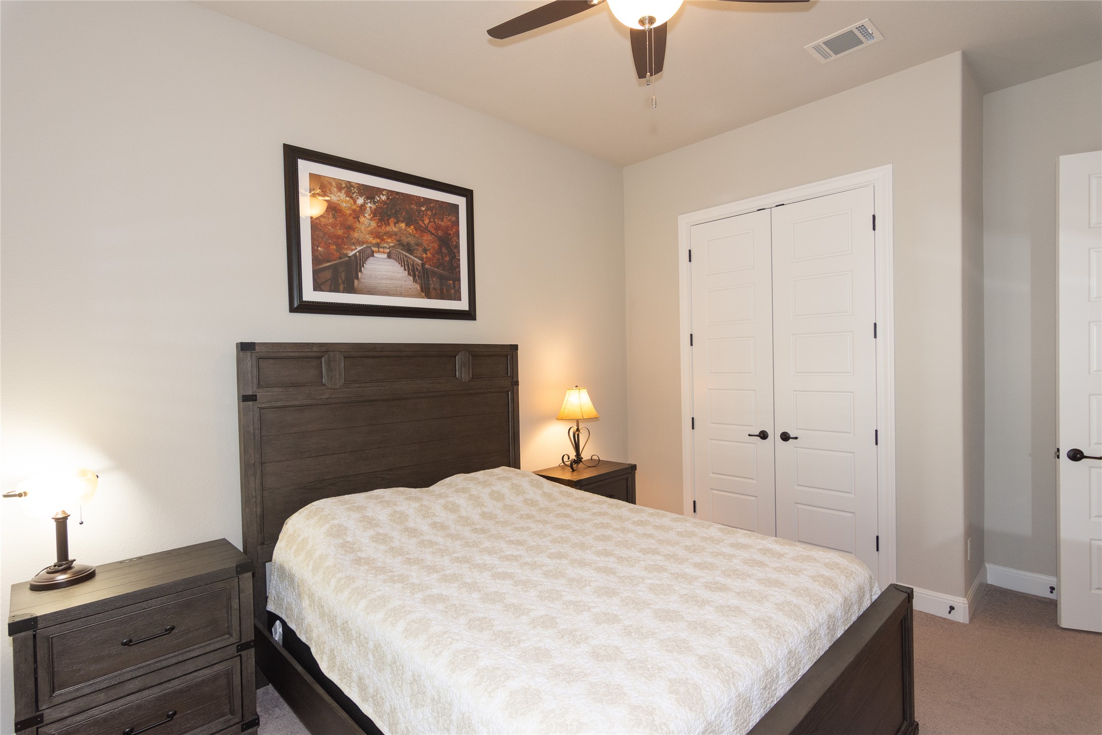 4733 Collins Street, Unit 610 Round Rock, TX 78628 - Photo 24 of 36 a bedroom with a bed and a chandelier
