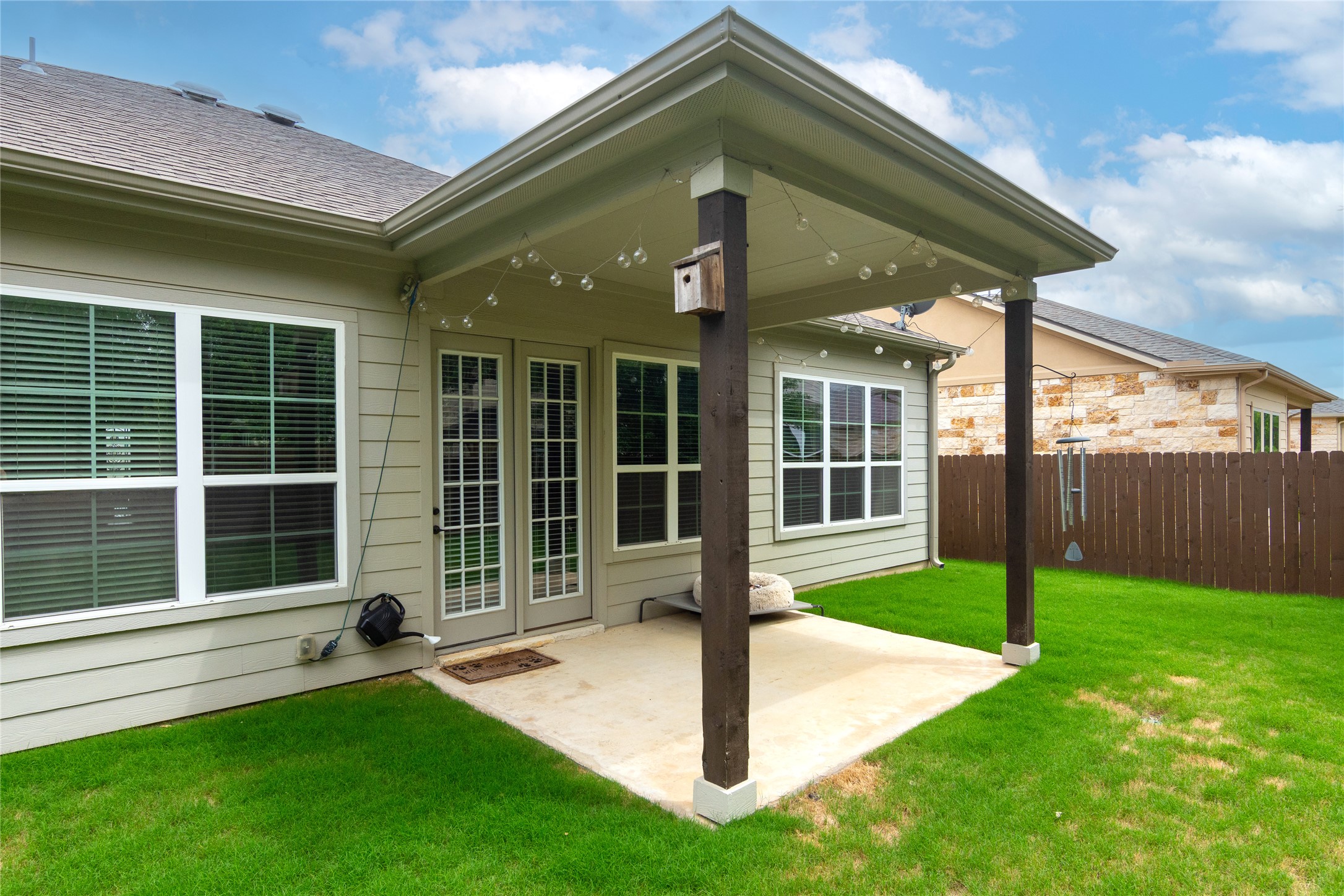 4733 Collins Street, Unit 610 Round Rock, TX 78628 - Photo 31 of 36 a front view of a house with a yard and porch