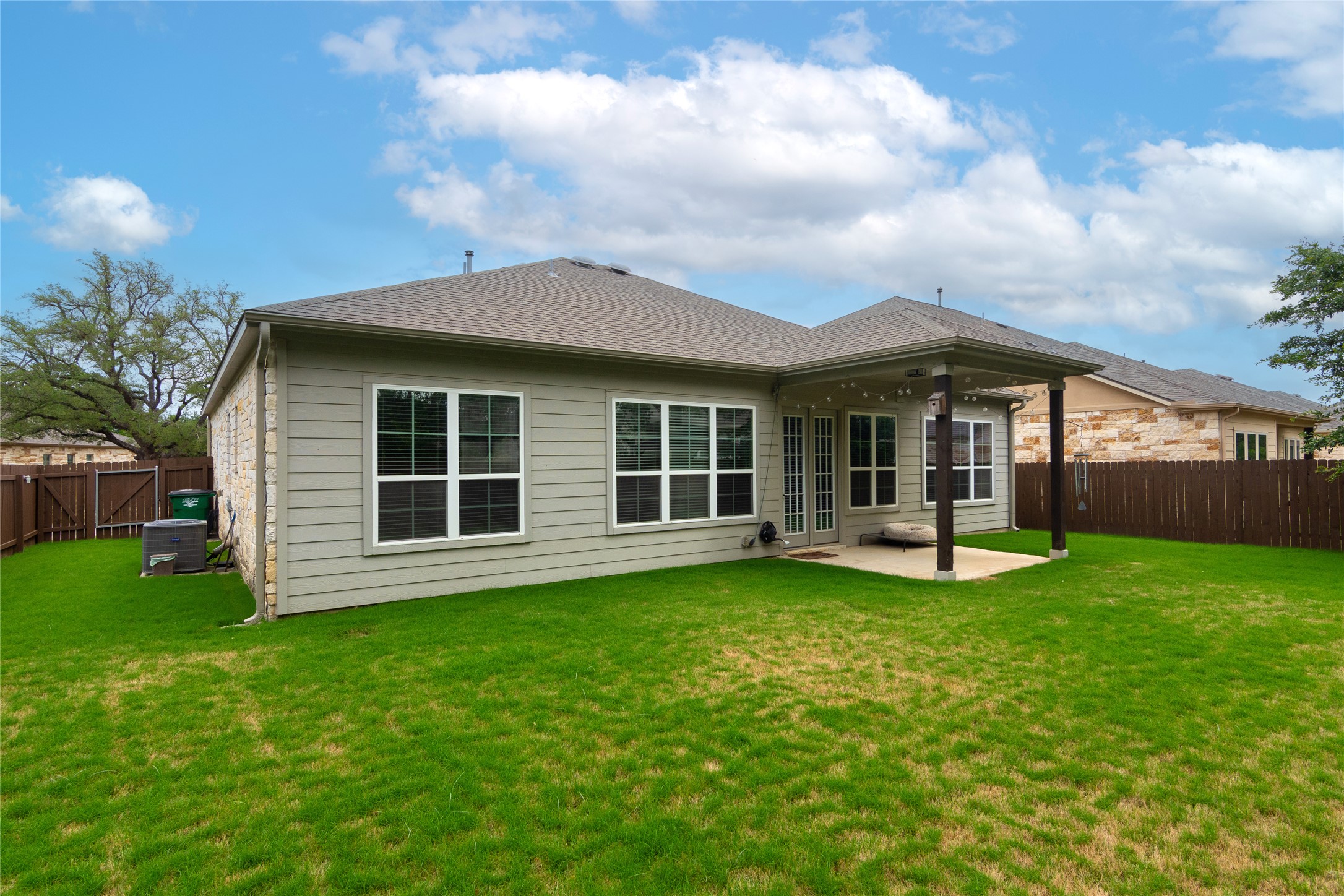 4733 Collins Street, Unit 610 Round Rock, TX 78628 - Photo 32 of 36 a view of a house with a yard and sitting area