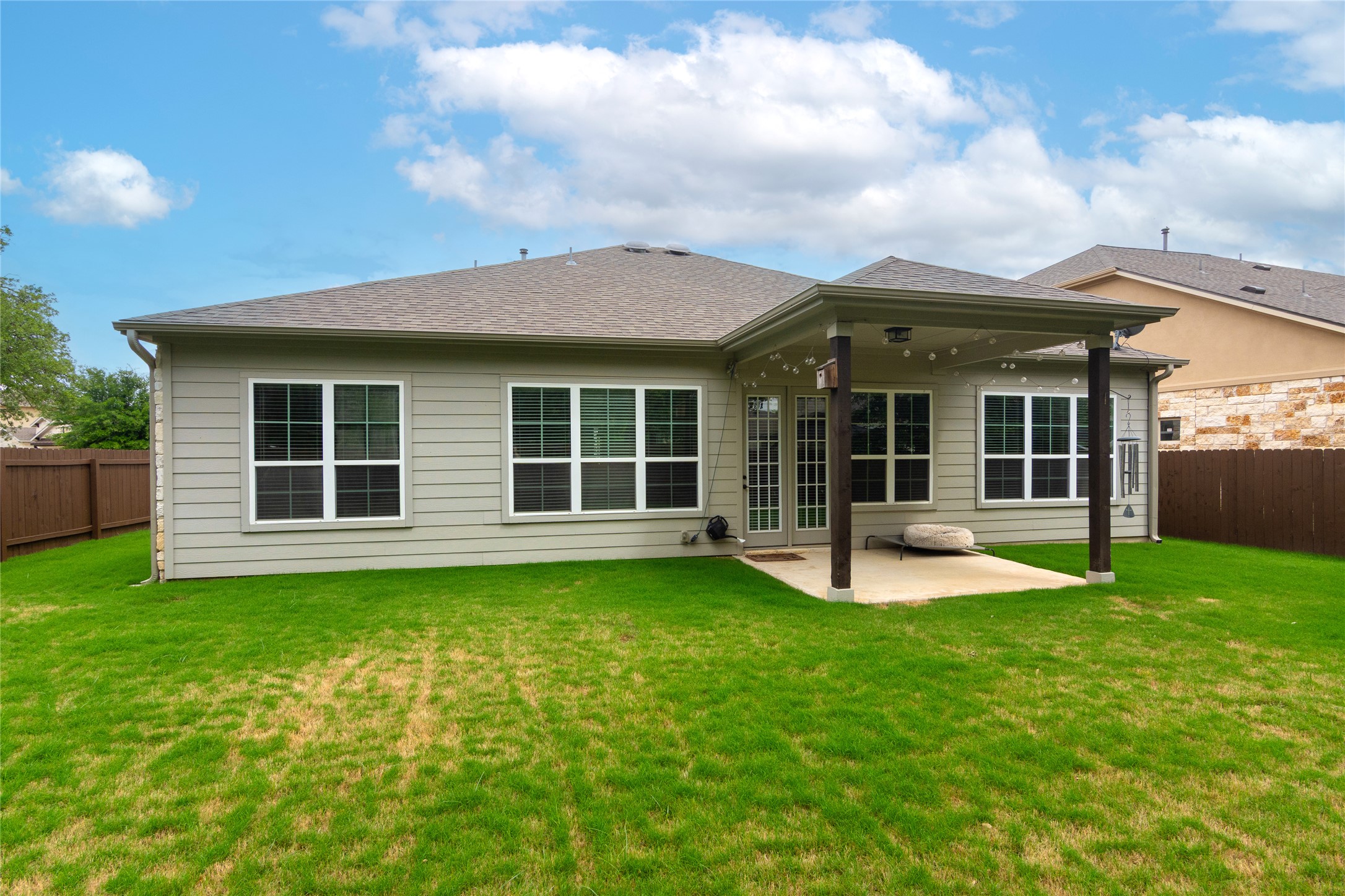 4733 Collins Street, Unit 610 Round Rock, TX 78628 - Photo 33 of 36 a view of a house with a yard and a large window