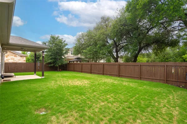 a view of a backyard with a small cabin