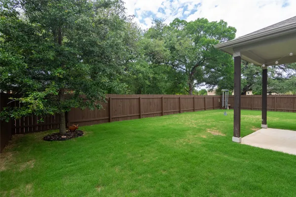 a view of a backyard with a slide