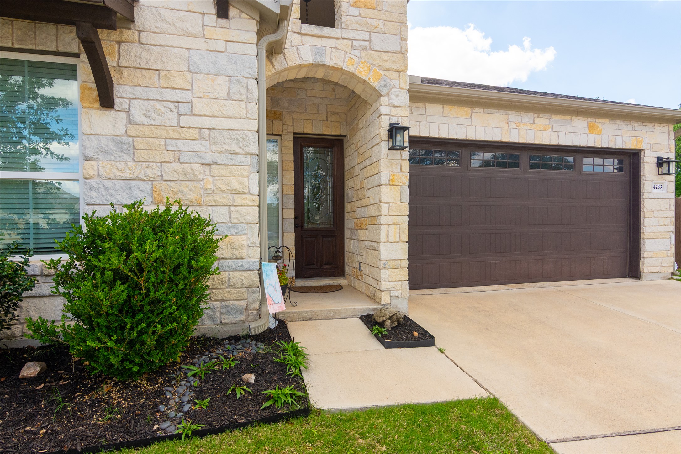 4733 Collins Street, Unit 610 Round Rock, TX 78628 - Photo 4 of 36 a front view of a house with a yard