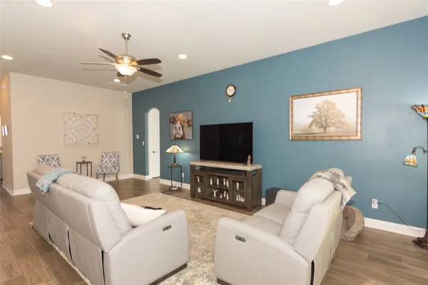 a living room with furniture and a flat screen tv