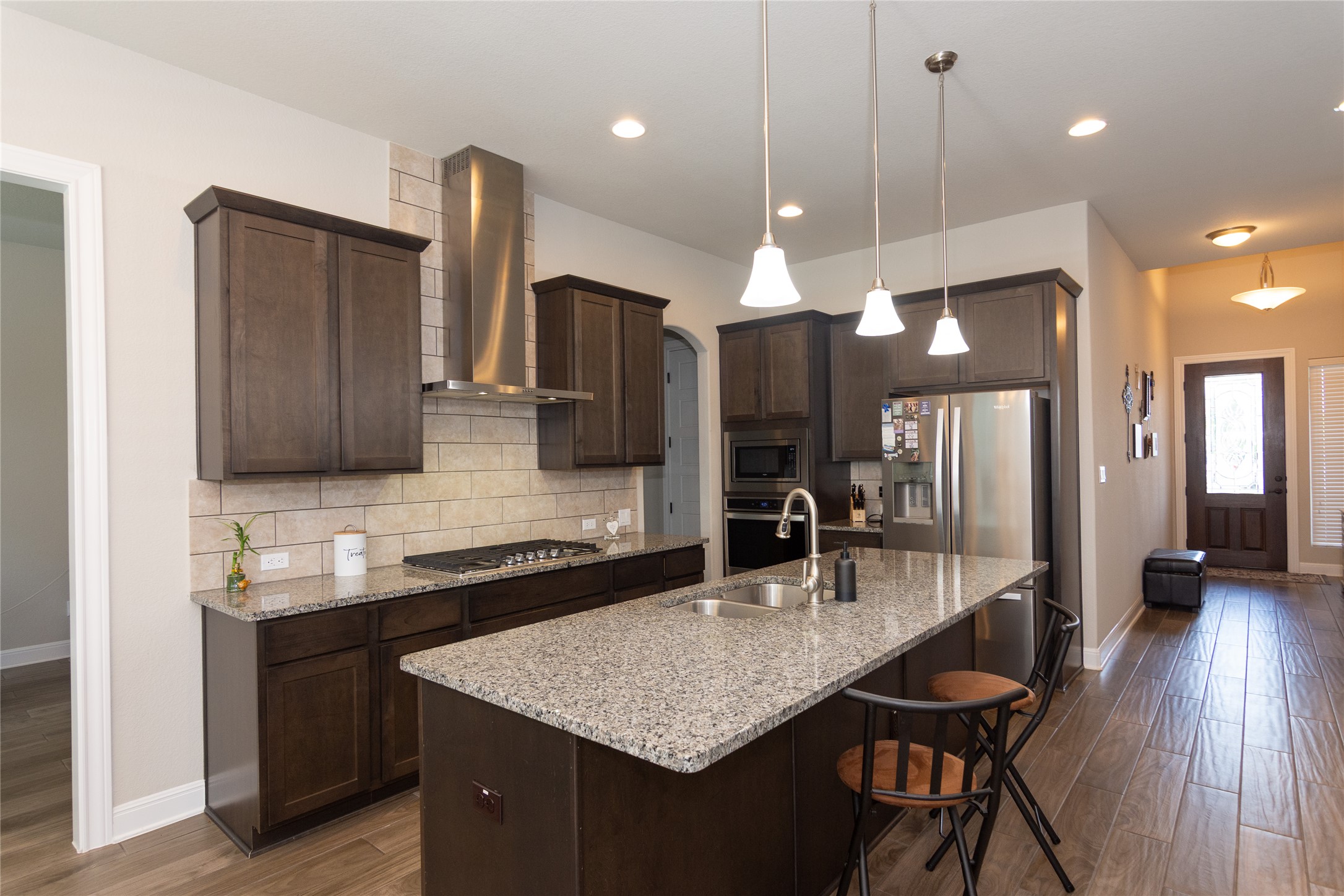 4733 Collins Street, Unit 610 Round Rock, TX 78628 - Photo 10 of 36 a kitchen with a counter space a sink cabinets and stainless steel appliances