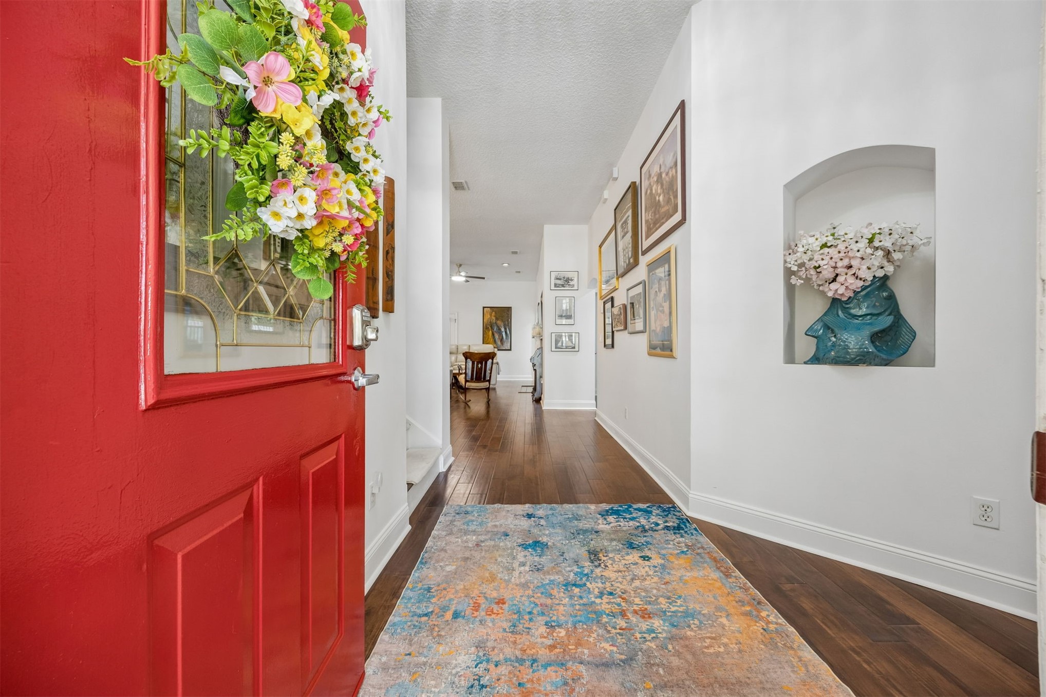 86107 Remsenburg Drive Fernandina Beach, FL 32034 - Photo 2 of 58 a view of hallway with wooden floor and a potted plant