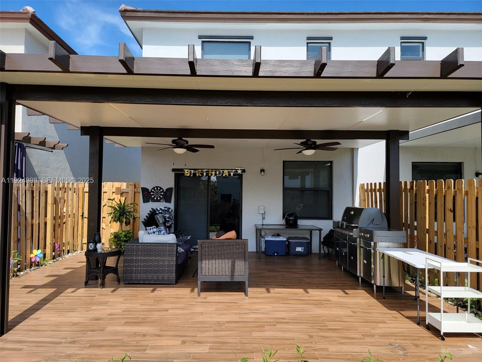 25278 Southwest 108th Avenue, Unit 1 Homestead, FL 33032 - Photo 9 of 10 a living room with furniture and wooden floor