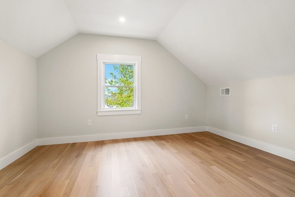 136 Wright Street Arlington, MA 02474 - Photo 30 of 38 an empty room with wooden floor and windows