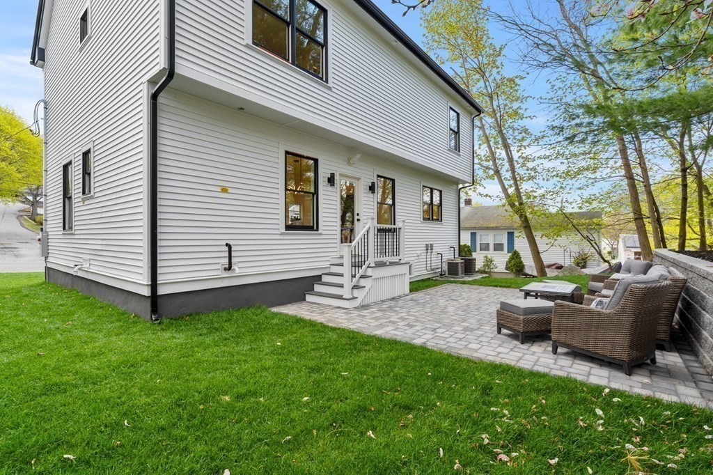 136 Wright Street Arlington, MA 02474 - Photo 37 of 38 a view of a house with backyard and a tree