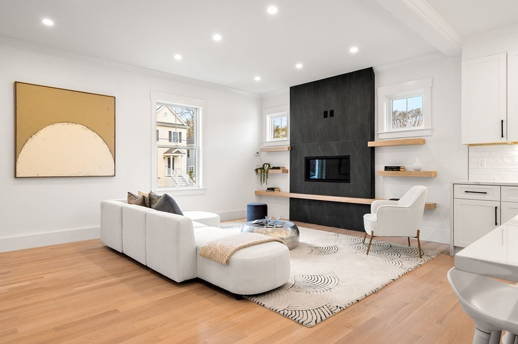136 Wright Street Arlington, MA 02474 - Photo 5 of 38 a living room with furniture and a fireplace