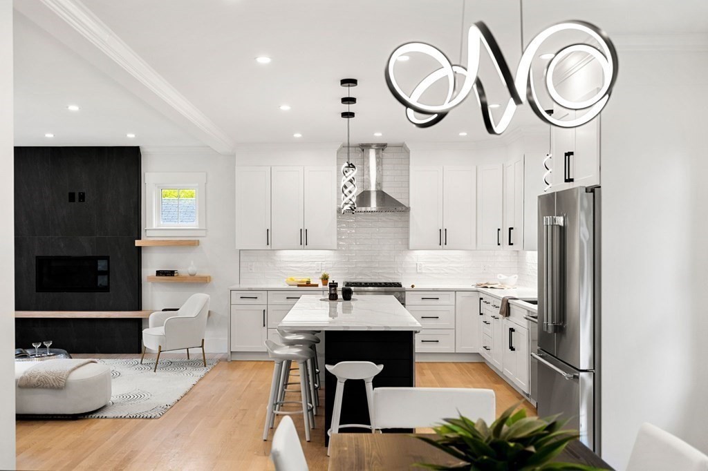 136 Wright Street Arlington, MA 02474 - Photo 8 of 38 a kitchen with stainless steel appliances granite countertop a sink a stove and a refrigerator