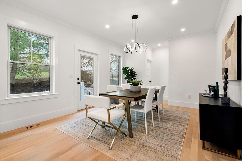 136 Wright Street Arlington, MA 02474 - Photo 9 of 38 a view of a dining room with furniture window and wooden floor
