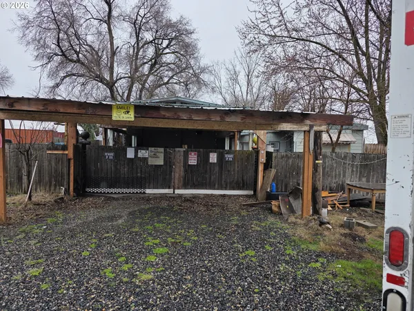 a view of a house with yard and furniture