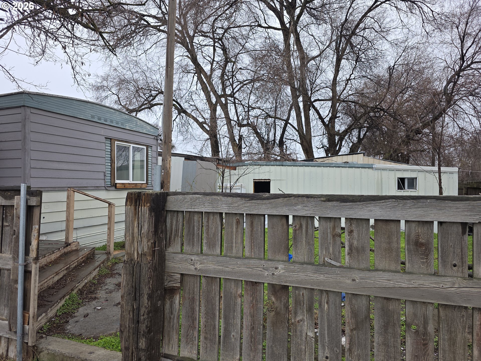 81876 Highway 395 Hermiston, OR 97838 - Photo 7 of 10 a view of wooden house with a large window and wooden fence