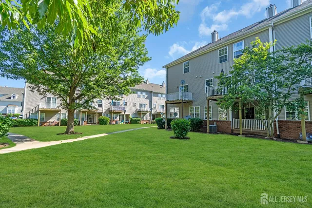 a view of a house with a back yard