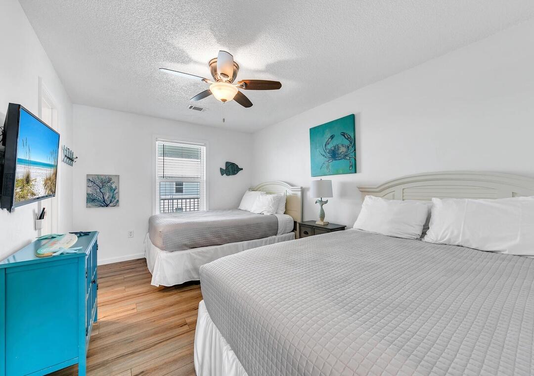 11 Beachside Drive, Unit 832 Santa Rosa Beach, FL 32459 - Photo 11 of 23 a bedroom with two beds and a flat screen tv