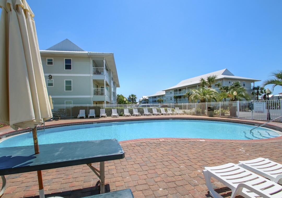 11 Beachside Drive, Unit 832 Santa Rosa Beach, FL 32459 - Photo 20 of 23 a view of swimming pool with outdoor seating and plants