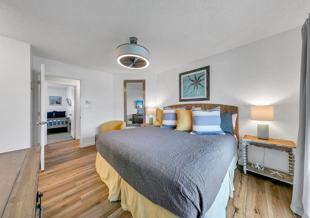 11 Beachside Drive, Unit 832 Santa Rosa Beach, FL 32459 - Photo 5 of 23 a bedroom with a bed and wooden floor
