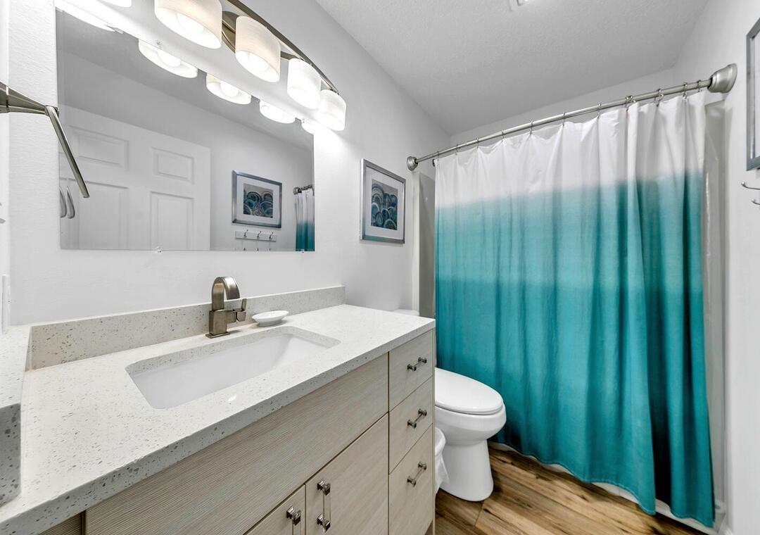 11 Beachside Drive, Unit 832 Santa Rosa Beach, FL 32459 - Photo 7 of 23 a bathroom with a sink a toilet and mirror