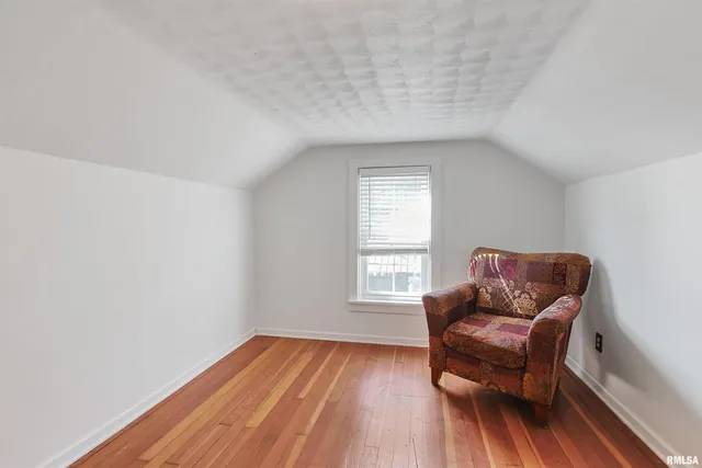 a living room with a couch and a window